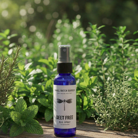 fresh mint, lavender sprigs, and cedarwood on a rustic wooden patio table